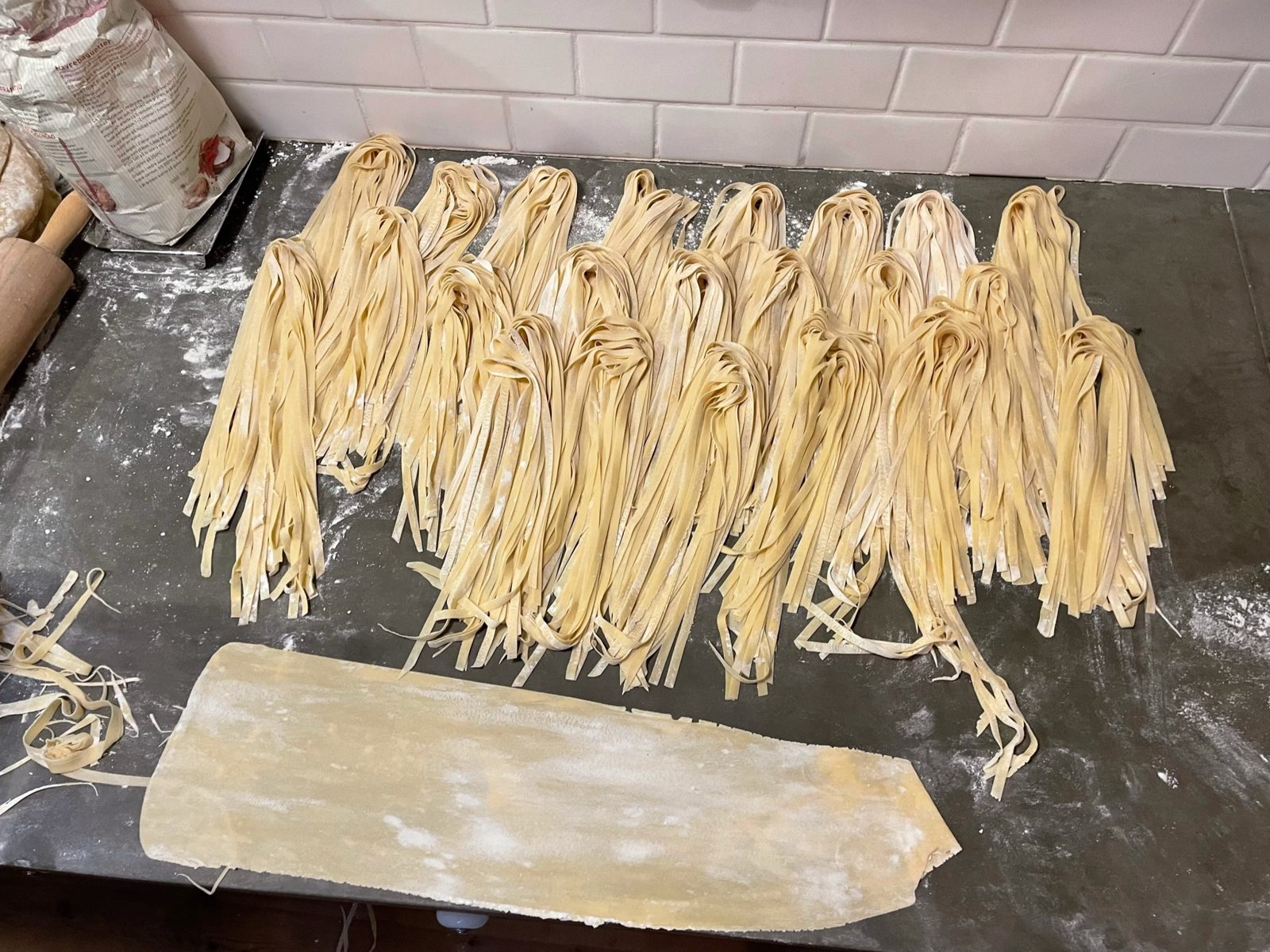 Fresh tagliatelle on a work bench in Bologna